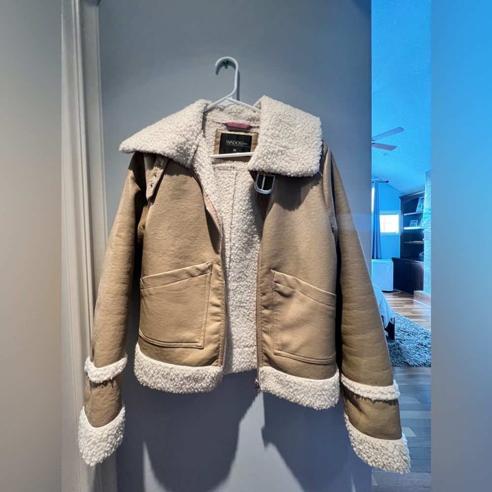Light brown bomber jacket ideally for winter . 
Says size medium runs SMALL
